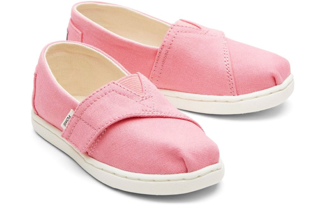 pair of pink toms shoes