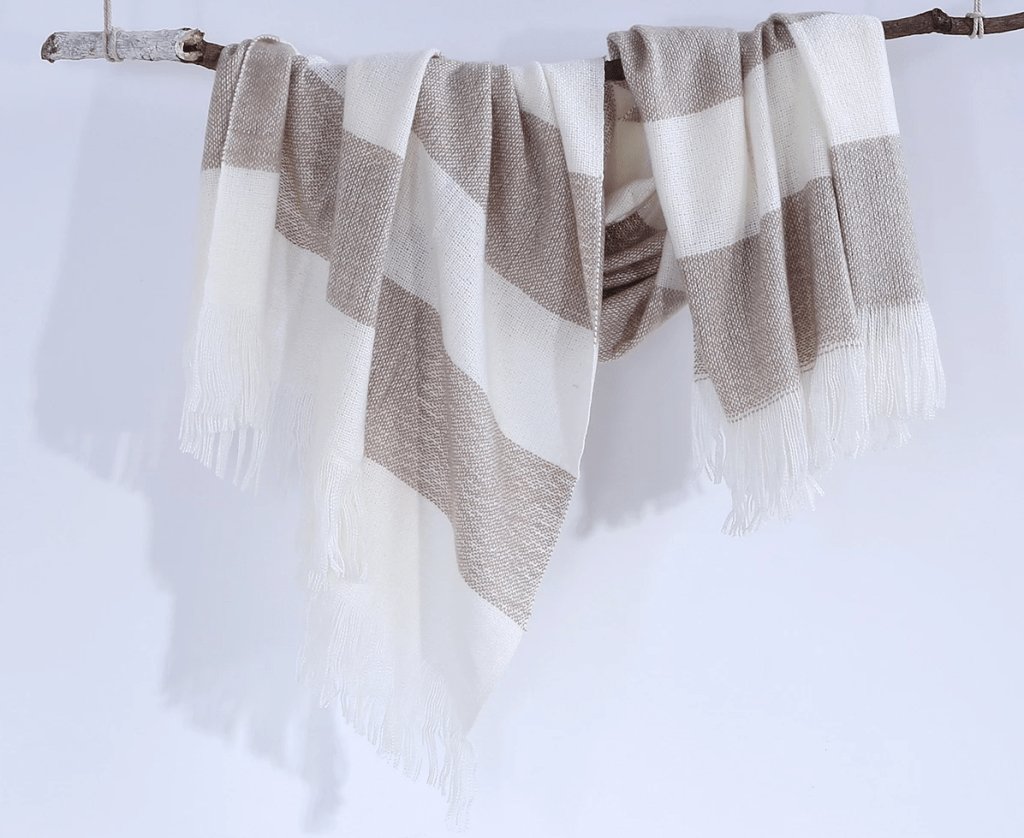 throw blanket draped on a stick