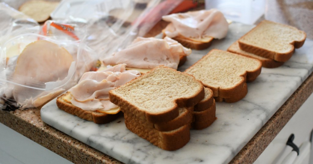 making turkey and cheese sandwiches