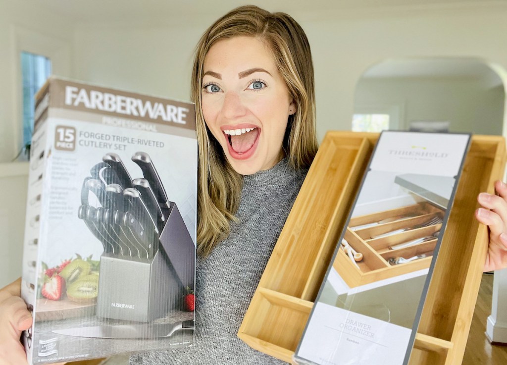 woman holding box of knives and bamboo utensil organizer