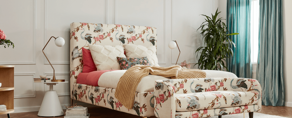 joybird bed with floral and bird design in bedroom 