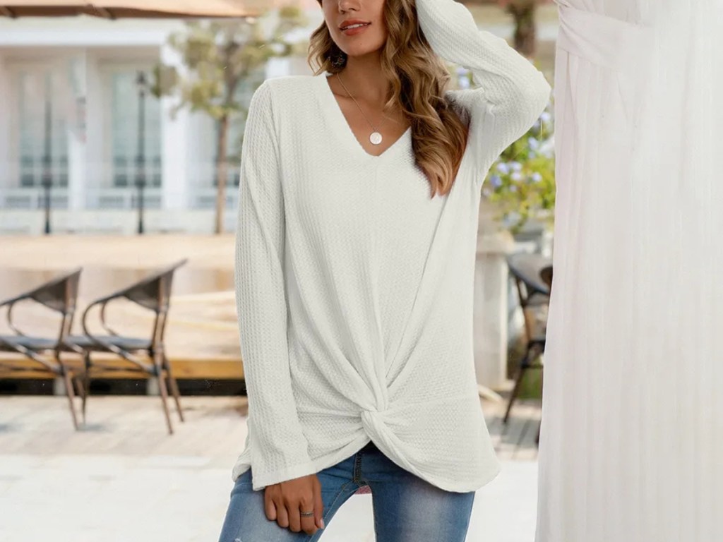 woman wearing white twist-front shirt
