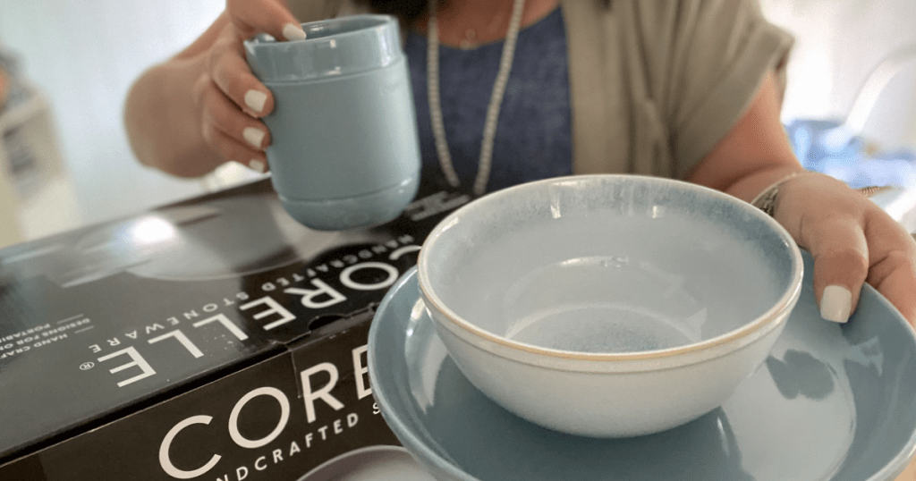 holding Corelle stoneware dishes 