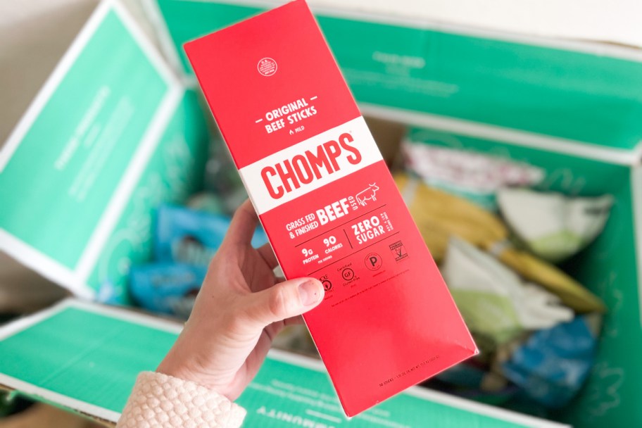 chomps beef sticks from thrive market in hand