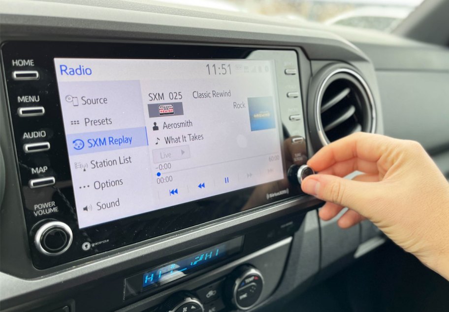 SiriusXM radio playing on car dashboard screen