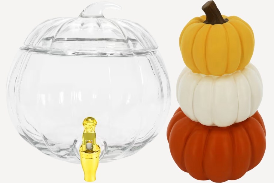 a 2 gallon glass pumpkin drink dispenser a pumpkin stack tabletop decor