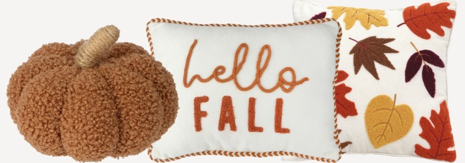a selection of fall themed pillows