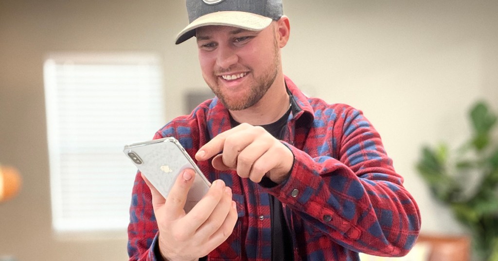 man on phone with hot deal text 'alerts