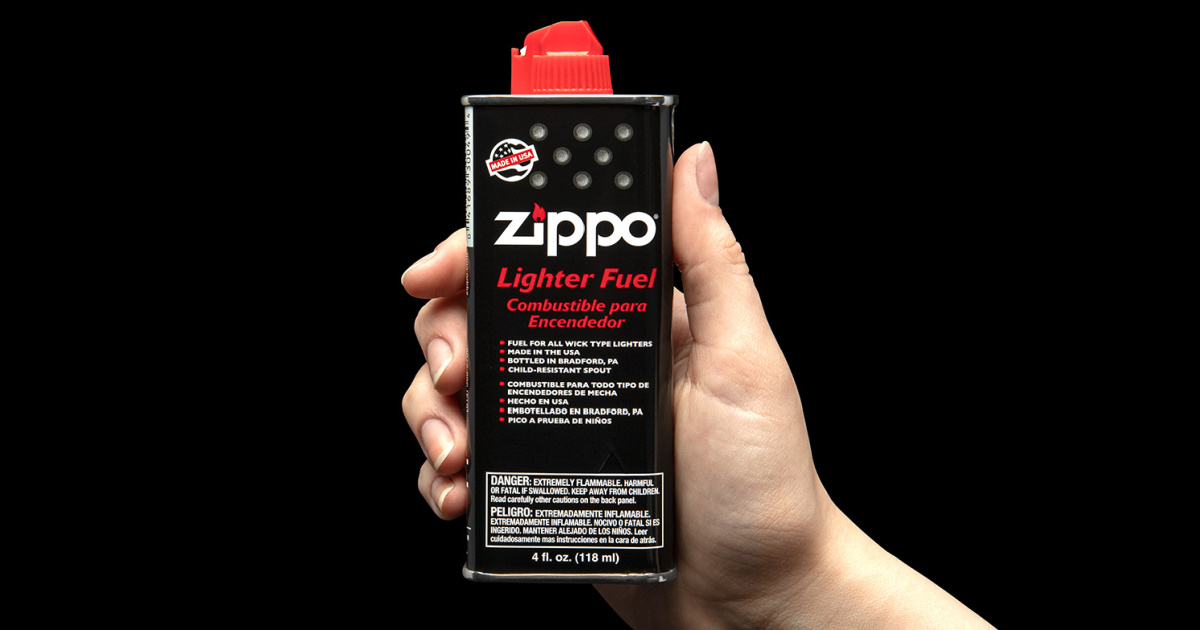 lighter fluid can in hand