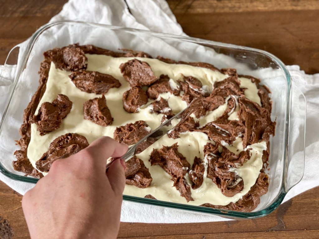swirling cream cheese brownie batter 