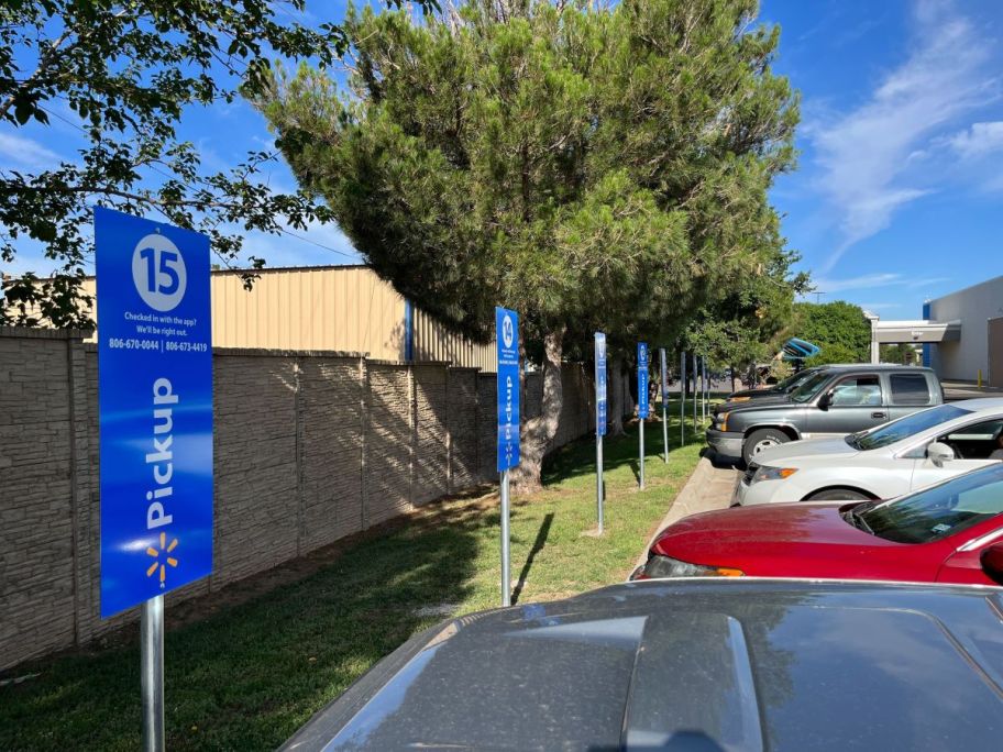 Walmart Grocery Pickup signs with cars 