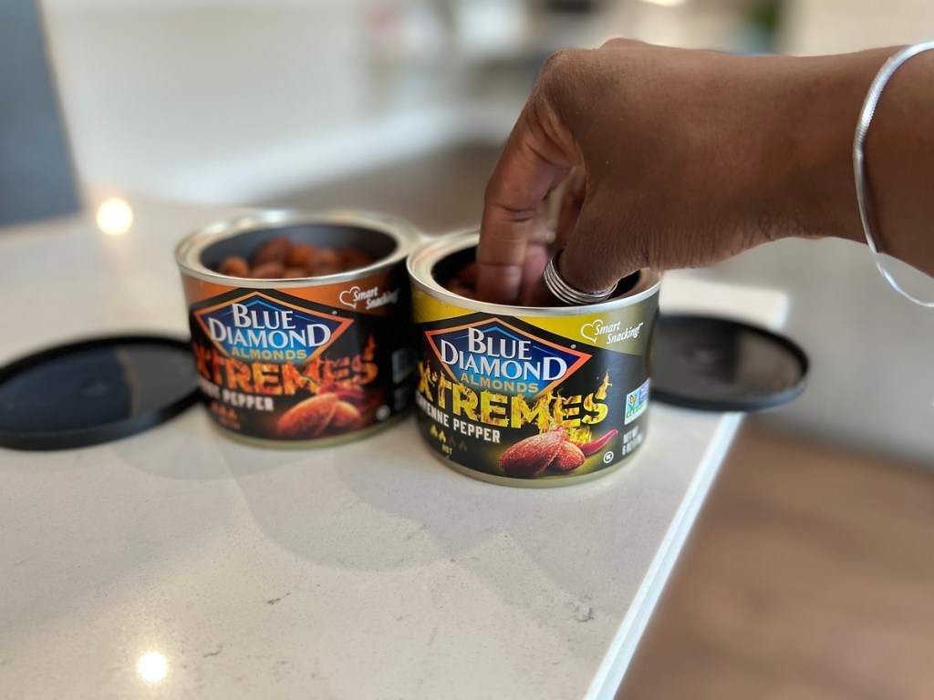 eating spicy almonds from the can