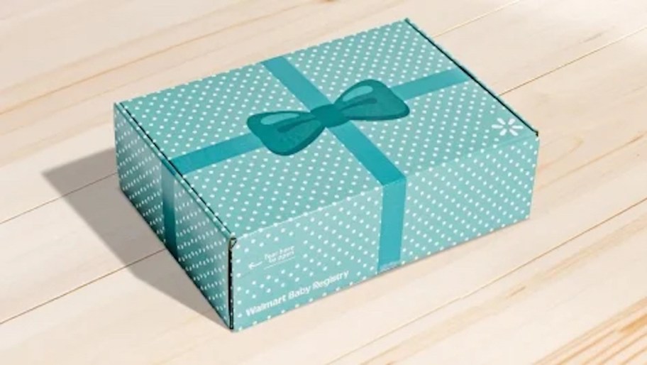 blue walmart baby registry box on wood floor