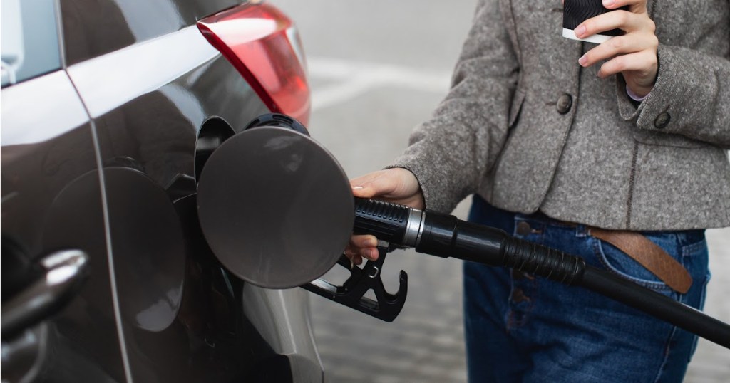 Woman at gas pump
