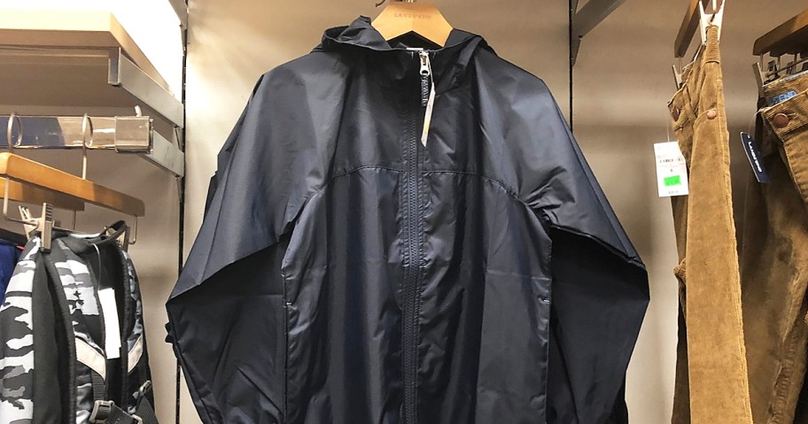 black rain jacket on a hanger in store