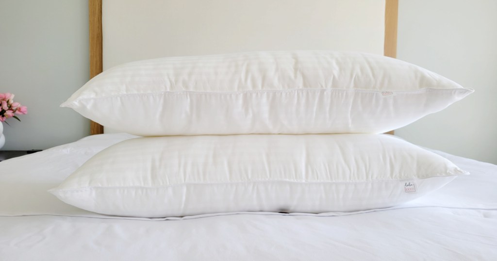 two pillows stacked on bed
