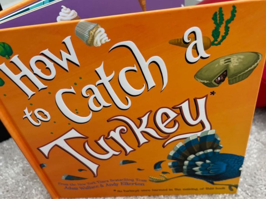 A hard-cover orange book titles "How to Catch a Turkey"