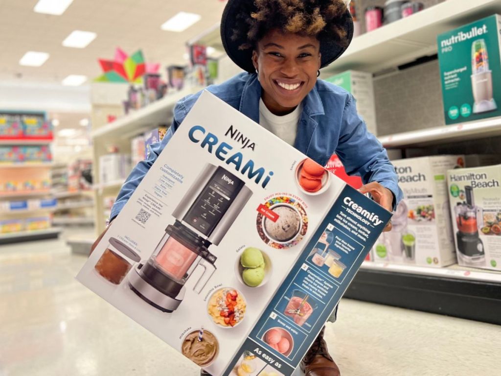 woman holding a Ninja Creami