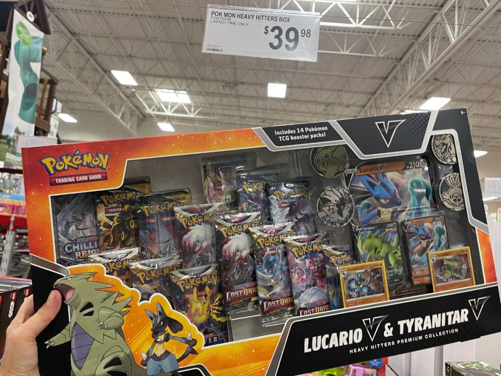 hand holding up Pok&eacute;mon Heavy Hitters Premium Collection in store