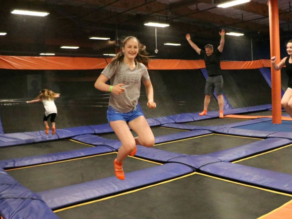 People jumping on huge trampolines