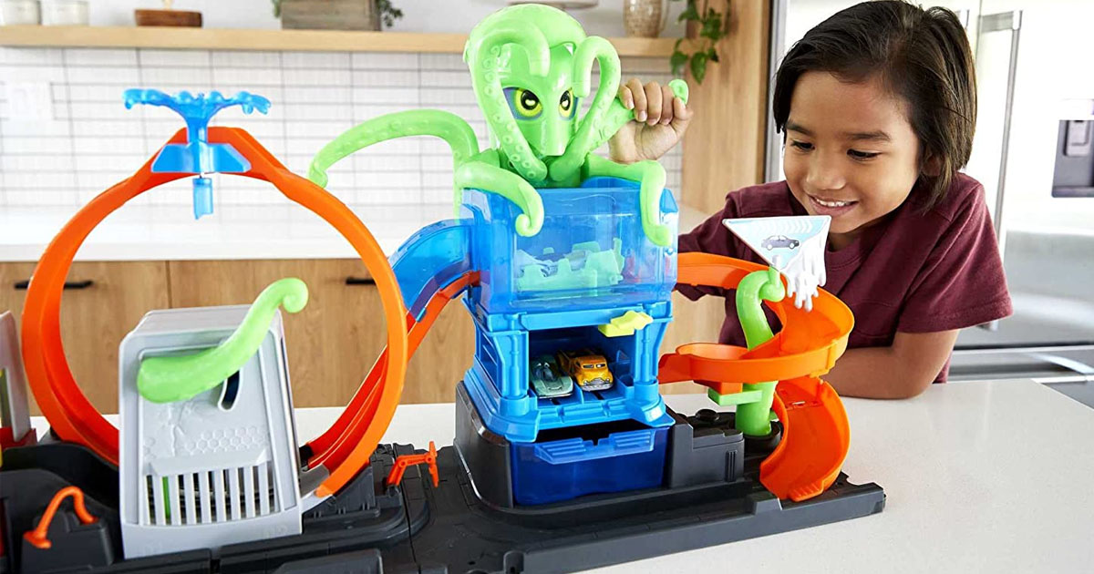 child playing with hot wheels octo car wash playset