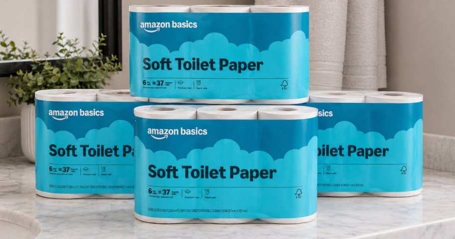 packs of toilet paper stacked on a bathroom counter