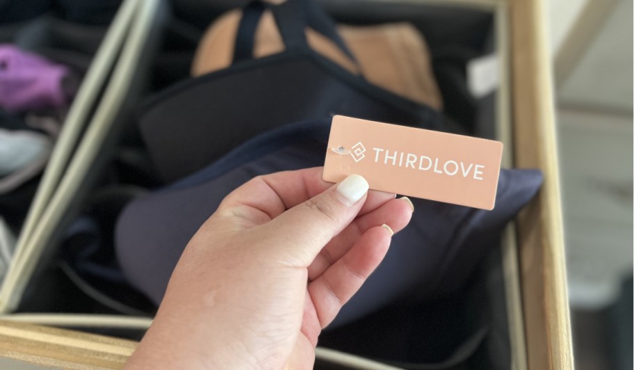 hand on bra tag