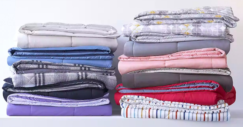 comforters in multiple colors folded and stacked