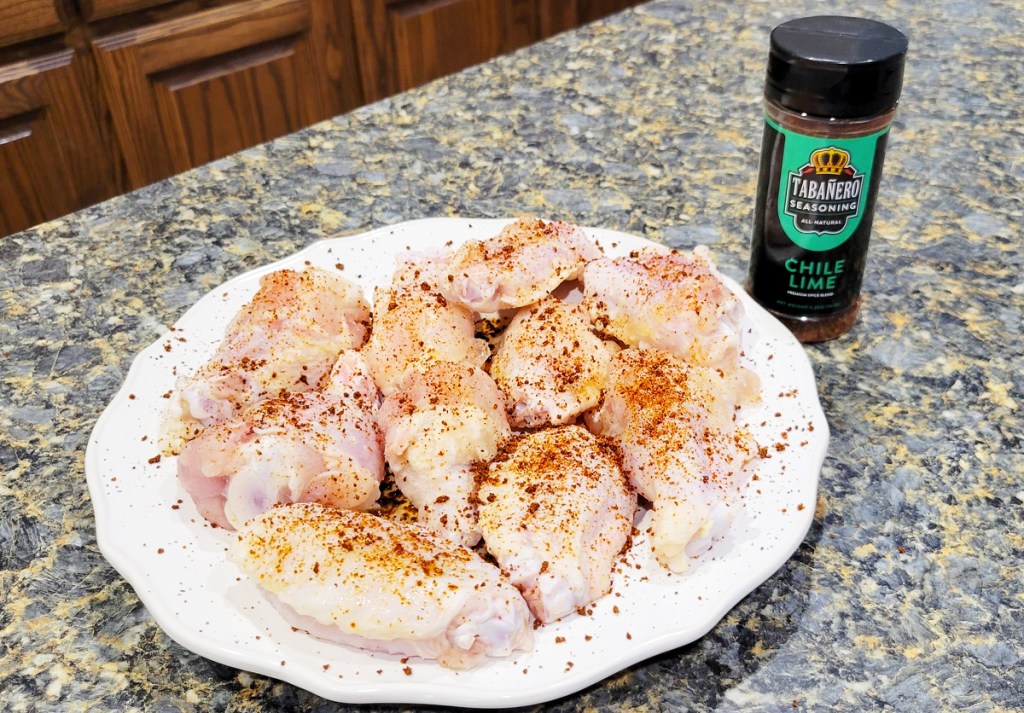 Taba&ntilde;ero Chili Lime Seasoning on raw chicken