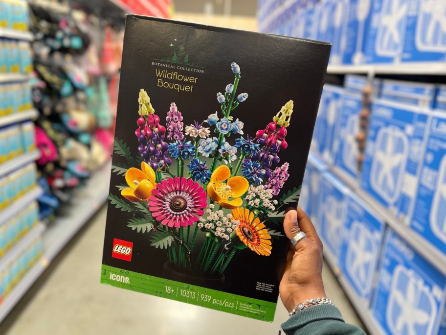 hand holding up LEGO Icons Wildflower Bouquet Set box in store