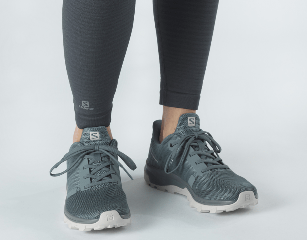 Woman wearing Salomon Outbound Prisms 
