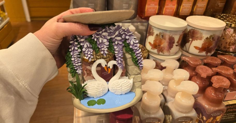 bath and body works Swan Candle Holder in hand in store