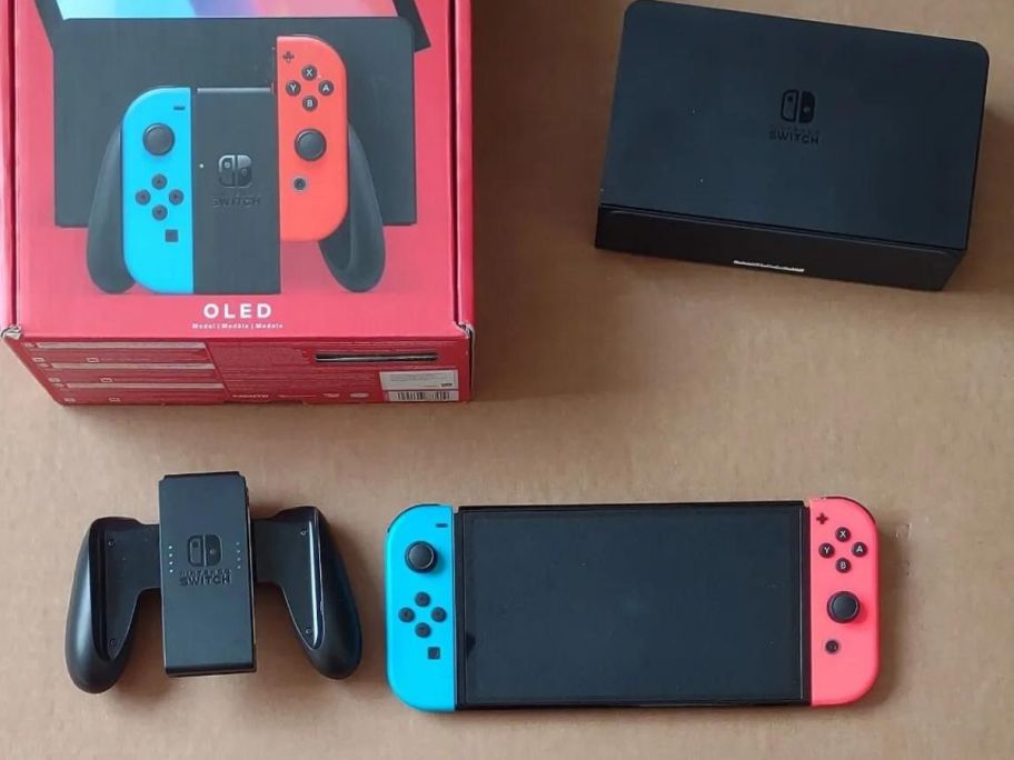 A Nintendo Switch &ndash; OLED Model w/ Neon Red & Neon Blue Joy-Con with box