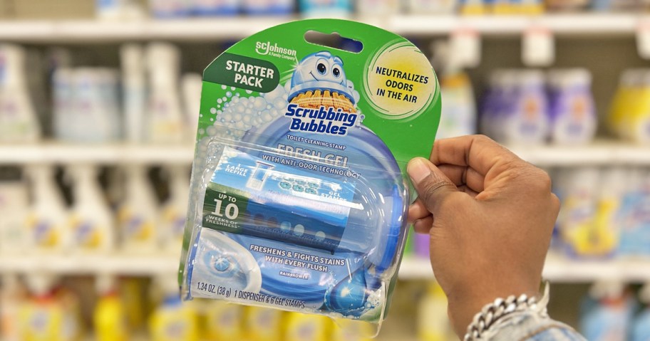 hand holding up Scrubbing Bubbles Dispenser
