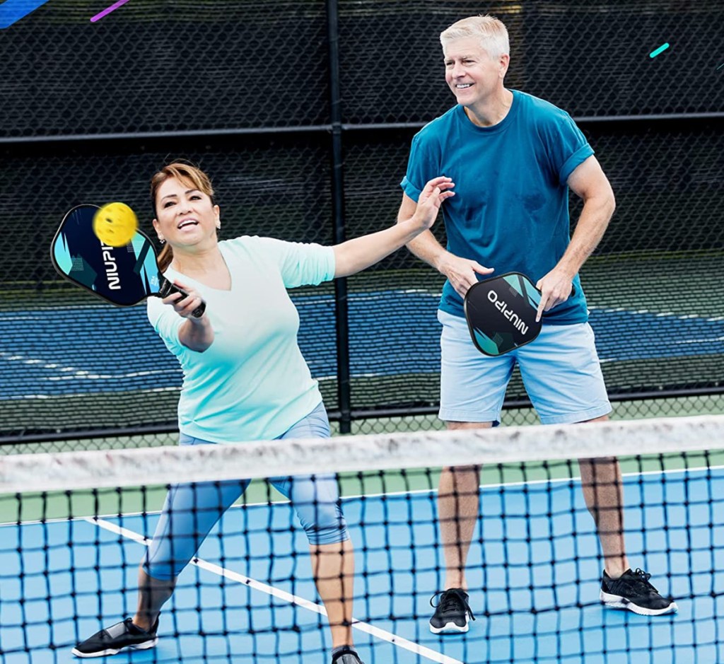 man and woman playing pickleball