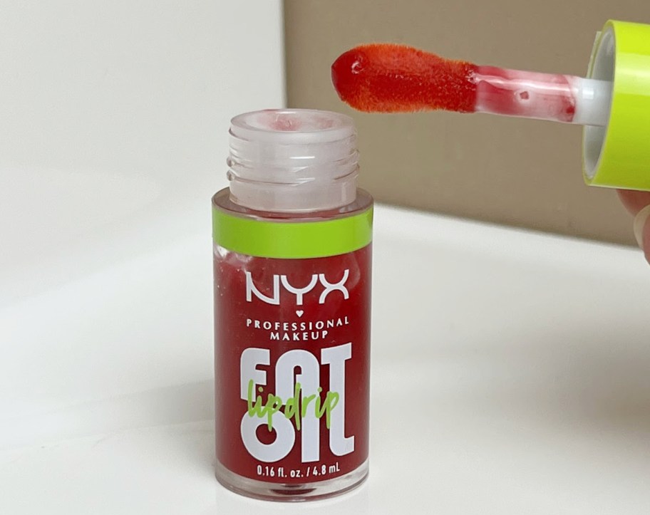 close up of bottle of nyc fat oil lip oil