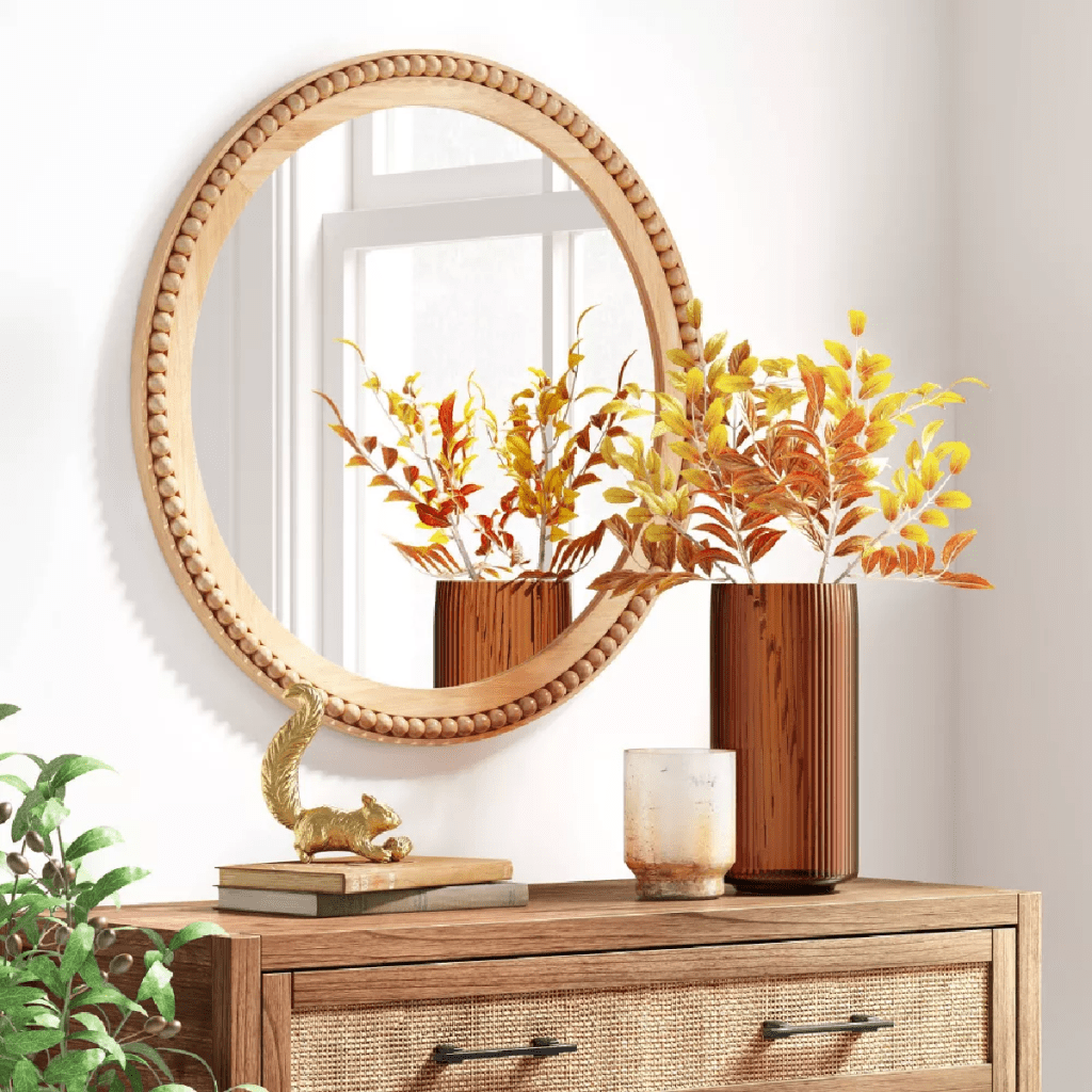 Threshold Wooden Beaded Wall mirror above a dresser