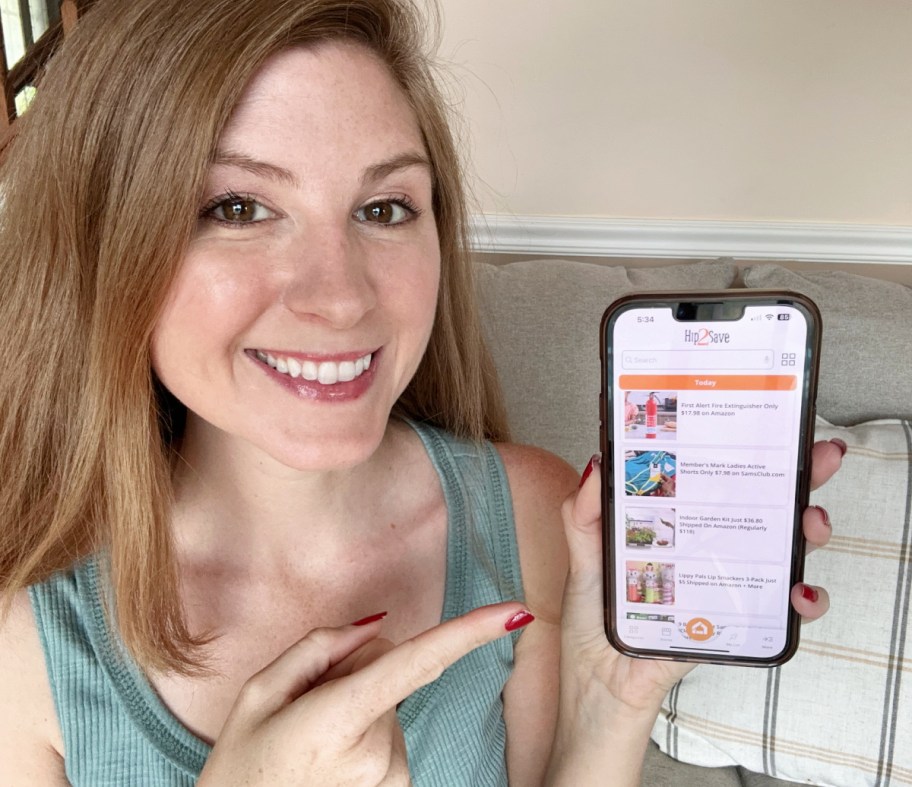 Woman pointing to the Hip2Save app on her phone