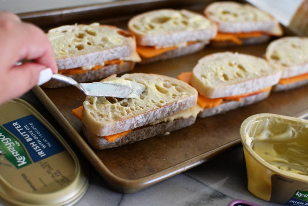 adding butter to top of bread