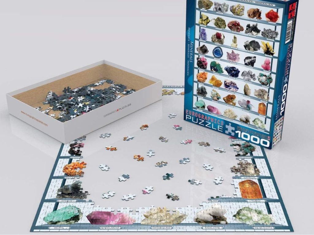 A puzzle half made and a box