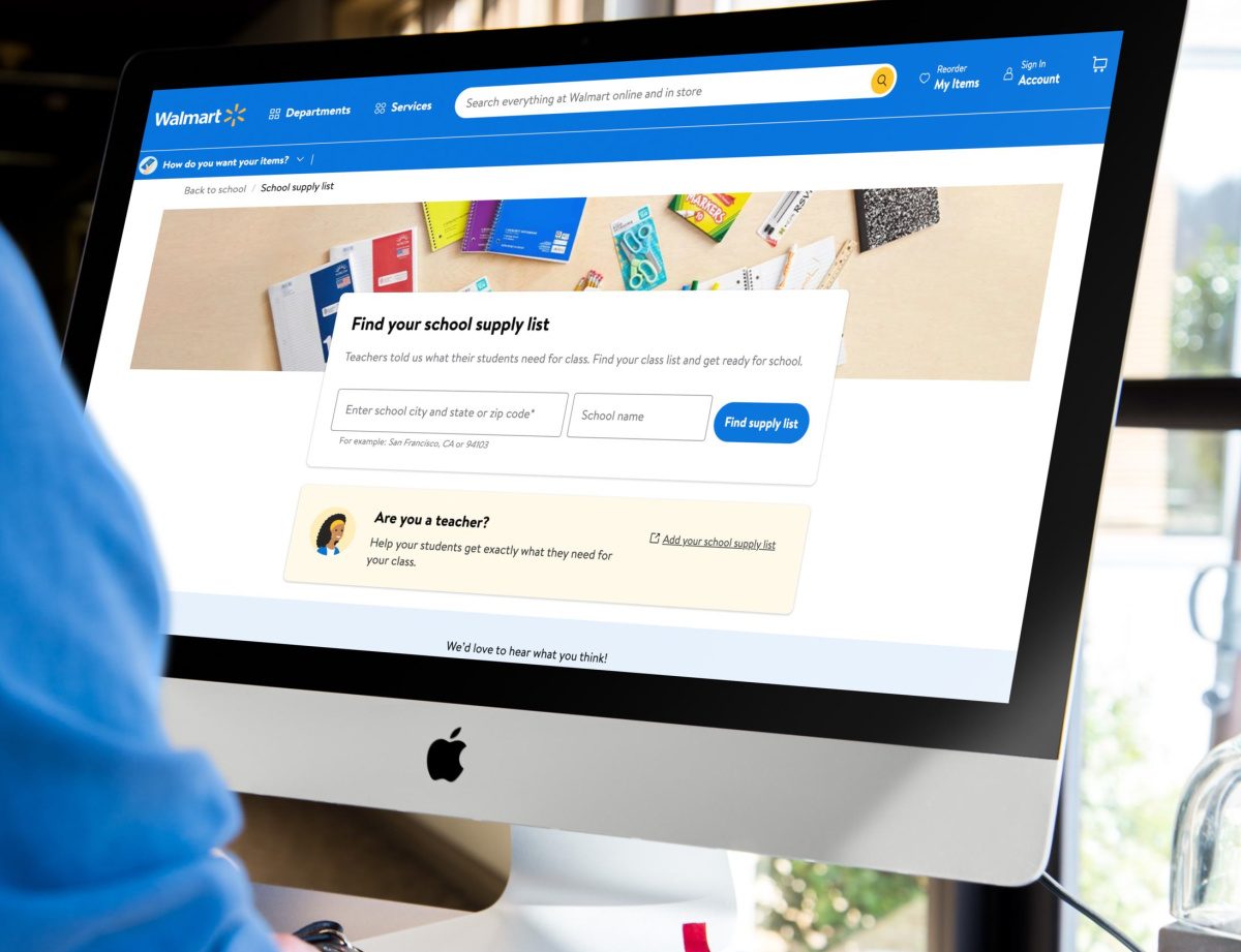 Parent searching Walmart's school supply list on the computer