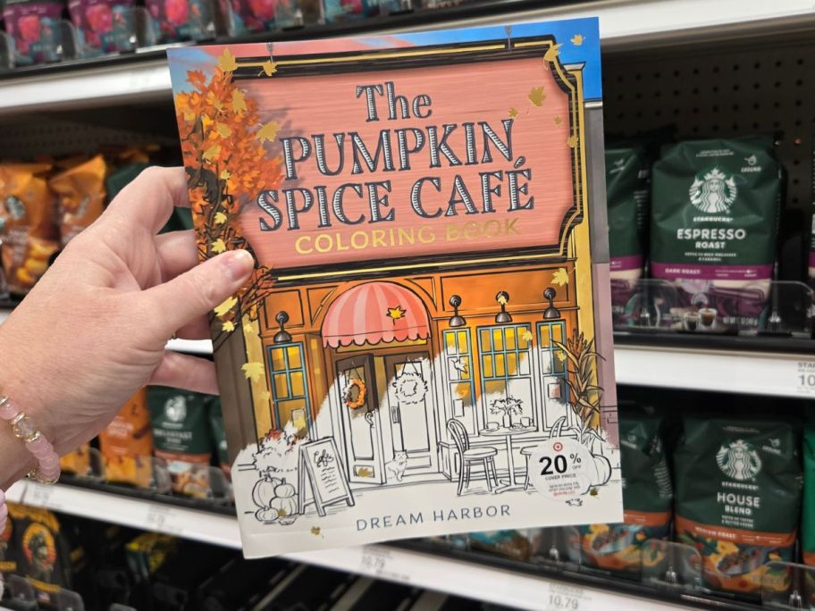Harper Collins The Pumpkin Spice Cafe Coloring Book in hand in store
