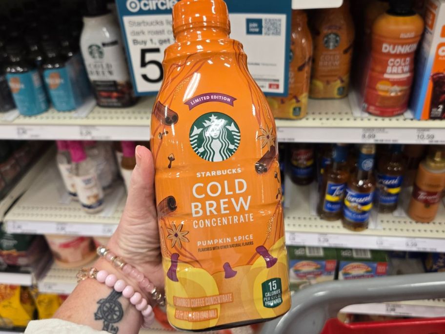 Starbucks Pumpkin Spice Cold Brew Concentrate&nbsp;bottle in hand in store