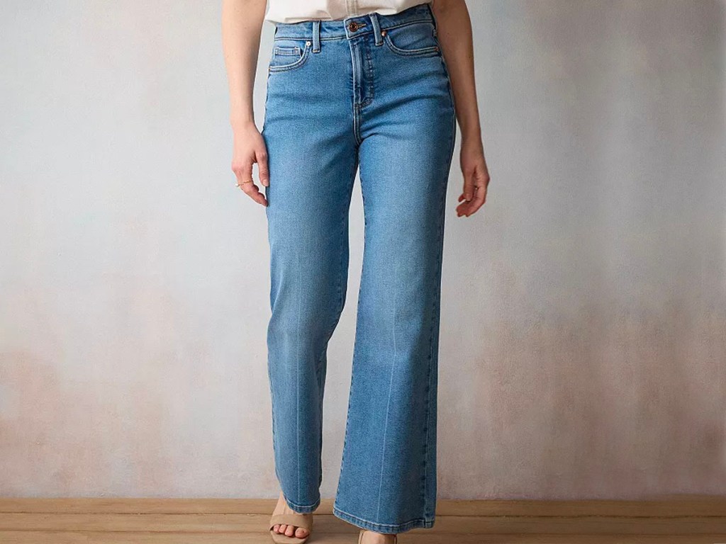 woman wearing white tee and blue jeans