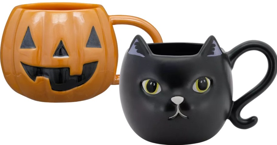 a jackolantern mug and a black cat mug