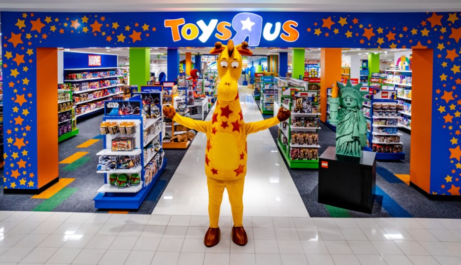 The Toys R Us Mascot standing outside a storefront