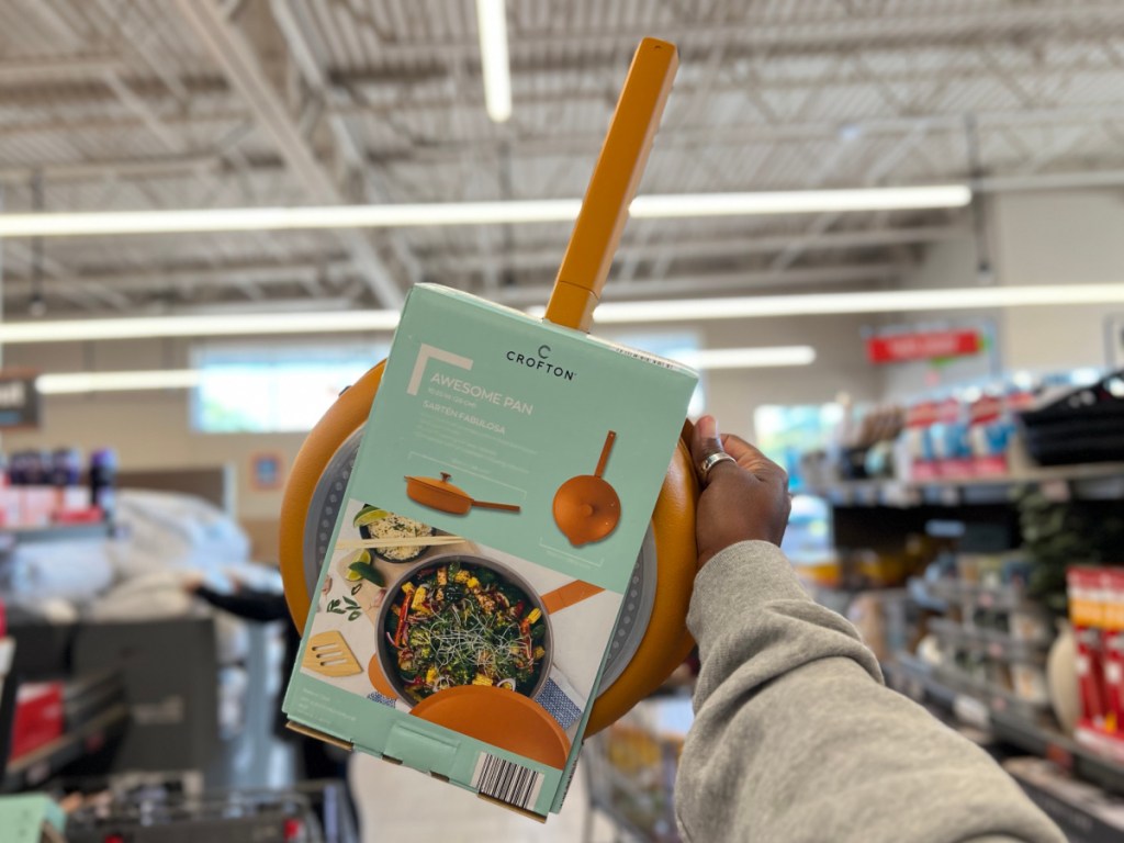 person holding up orange Crofton Awesome Pan