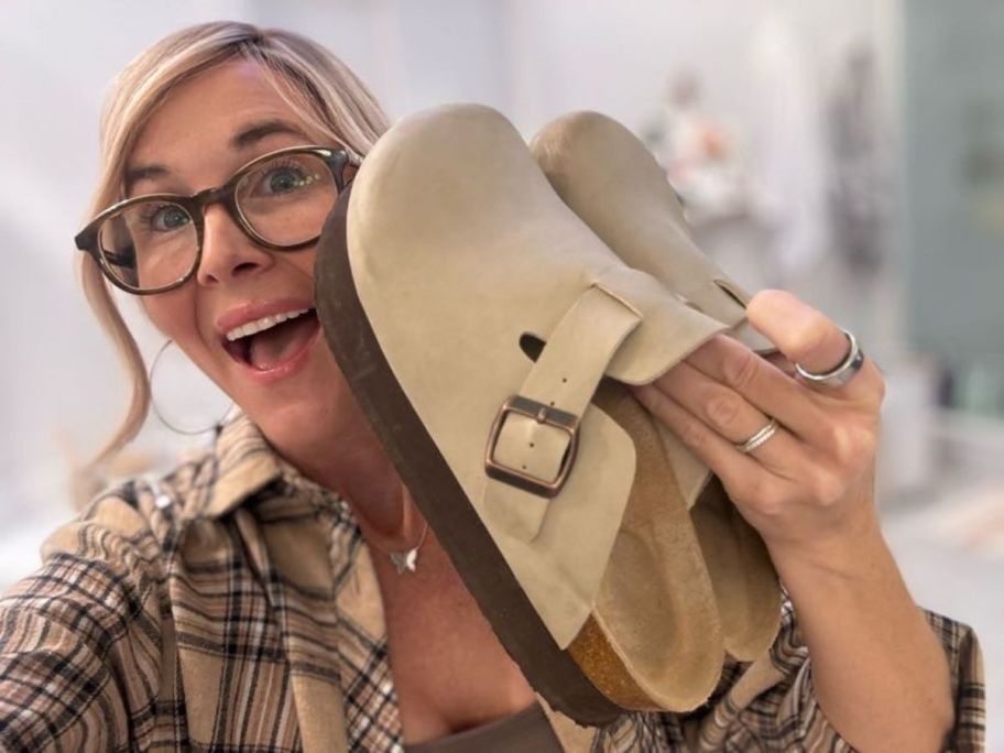 woman holding Cushionaire Platform Clogs