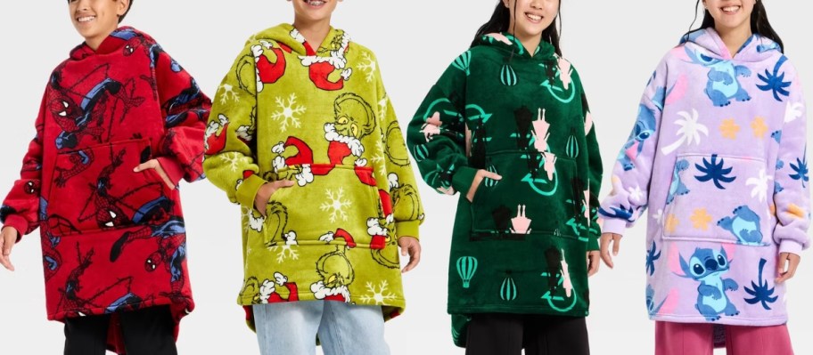 4 kids wearing oversized plush character hoodies