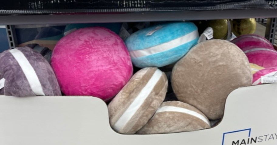 throw pillows that look like Macaroon cookies in a display box
